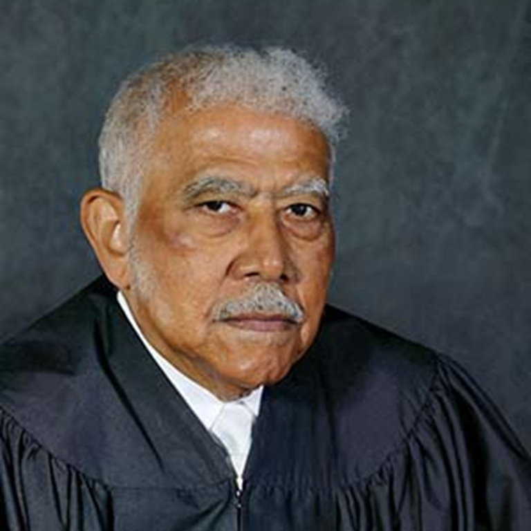 Color photo of Justice Revius O. Ortique Jr., wearing black judicial robes.