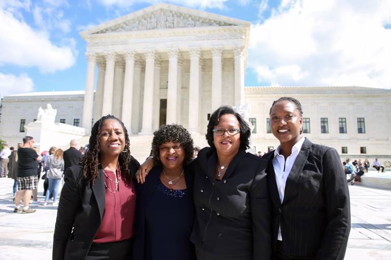 Color photo of LDF's then-President and Director-Counsel Sherrilyn Ifill (left), Associate Director-Counsel Janai Nelson (right), and Counsel Christina Swarns (second from right) with Phyllis Taylor (second from left, family member of plaintiff Duane Buck) standing outside the Supreme Court after the Buck v. Davis decision.