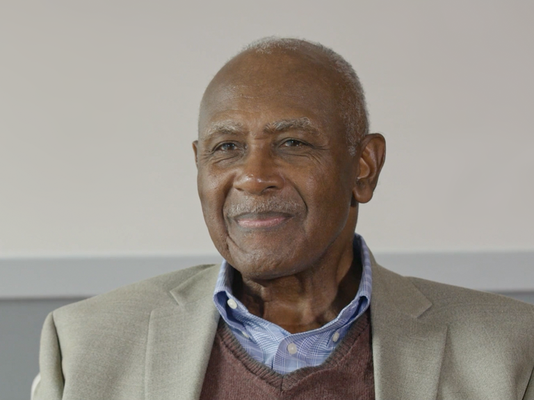 Color photo of Harvey Gantt seated during his oral history interview.