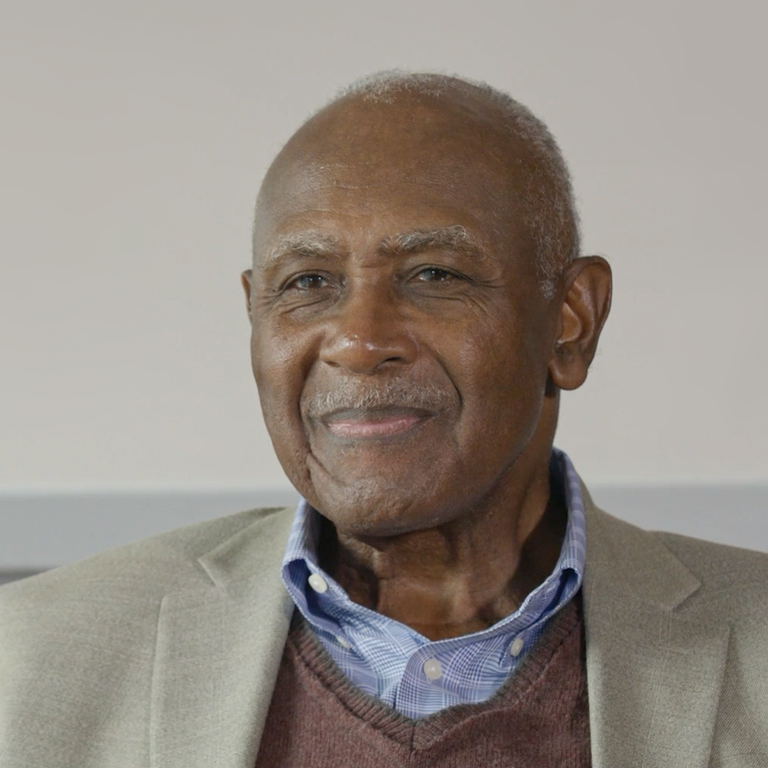 Color photo of Harvey Gantt seated during his oral history interview.
