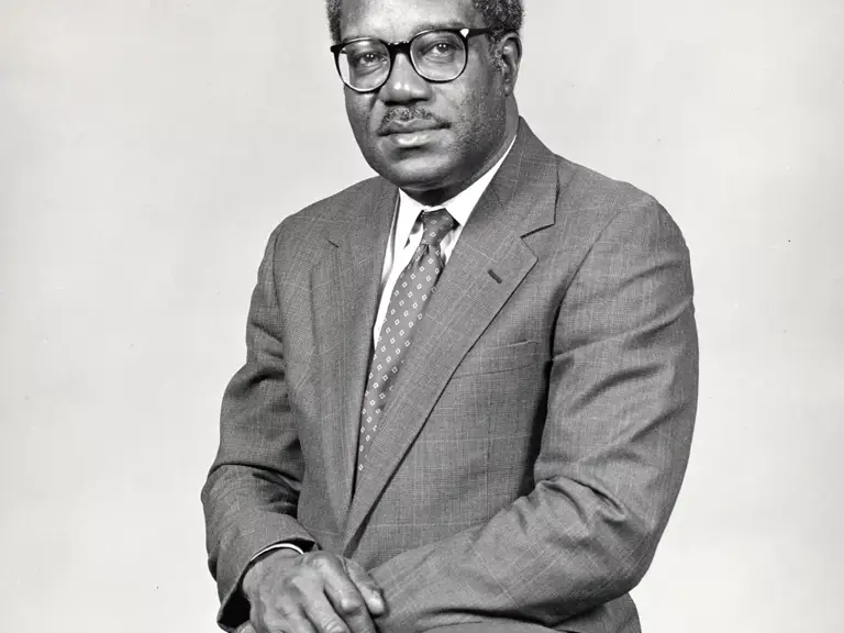 Black-and-white photo of Julius Levonne Chambers, LDF's third Director-Counsel, seated and wearing a suit and glasses.