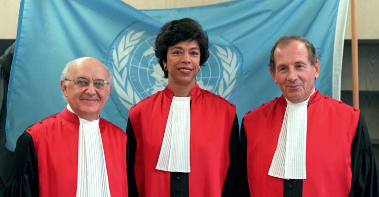 Gabrielle Kirk McDonald (center) stands with Antonio Cassese (left) and Claude Jorda (right) of the International Criminal Tribunal for the Former Yugoslavia in November 1999.