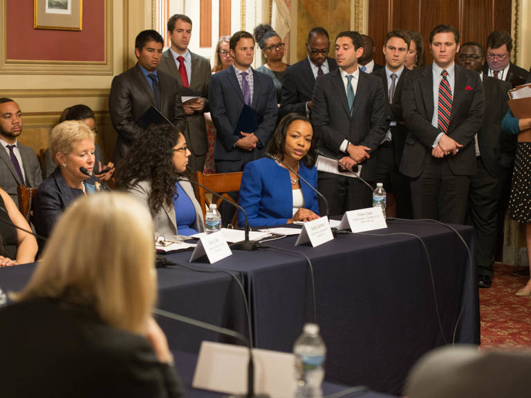 Kristen Clarke, seated, speaks during a congressional hearing alongside MALDEF Regional Counsel Andrea Senteno in the In the U.S. Capitol Building’s Lyndon B. Johnson Room.