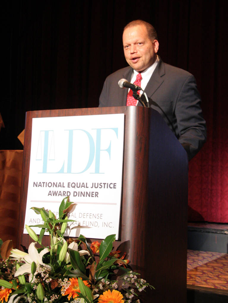 Color photo of Ted Shaw standing behind a podium and wearing a suit as he speaks during LDF’s National Equal Justice Award Dinner on November 3, 2005.