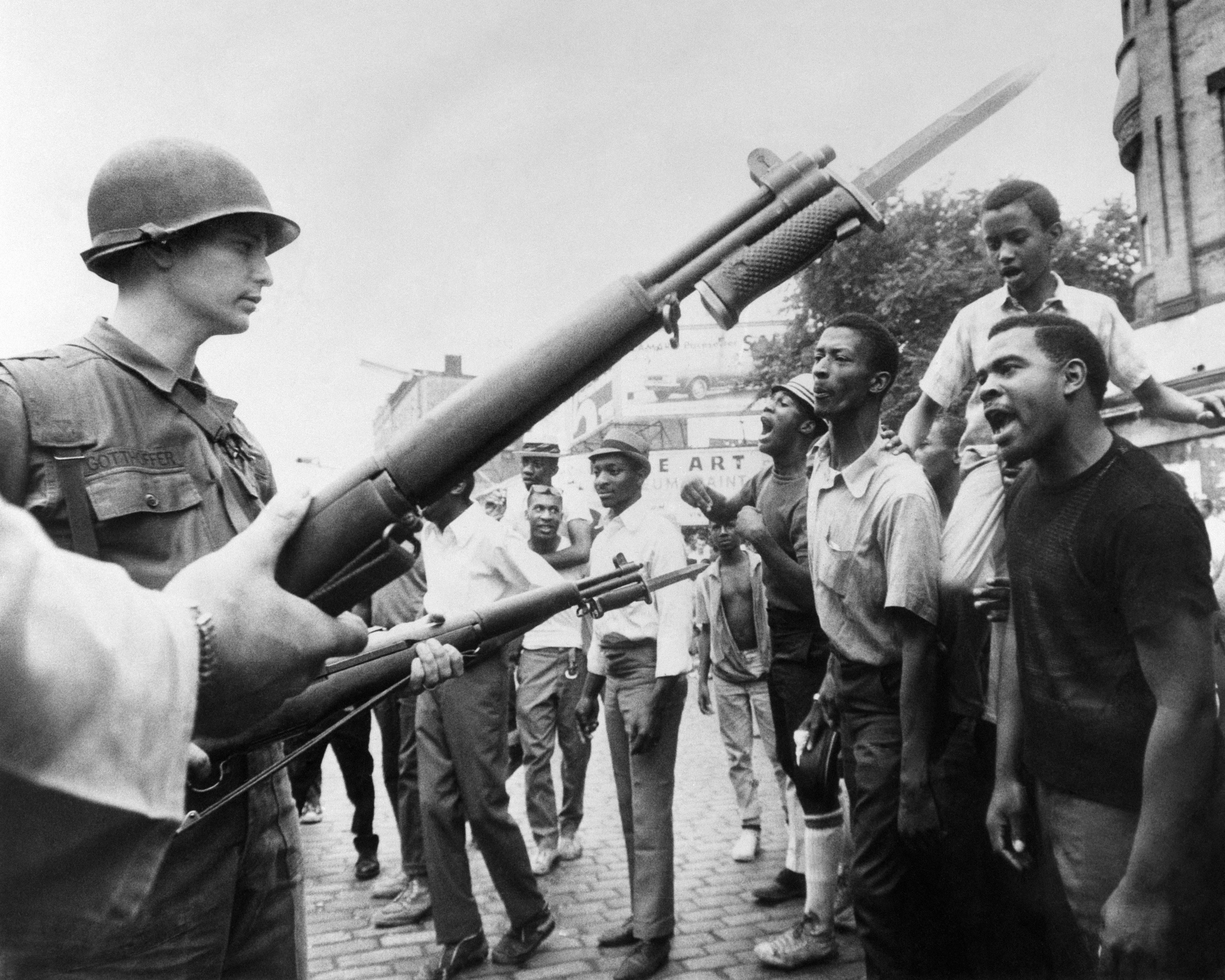 Black demonstrators face armed federal soldiers in Newark, New Jersey, on July 17, 1967, during protests that erupted following a police operation.