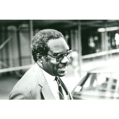 Black-and-white photo of Julius Chambers, LDF’s third Director-Counsel, wearing glasses and a suit.